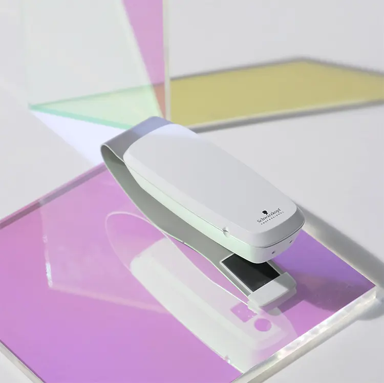 SalonLab Smart Analyzer displayed on colorful background. 