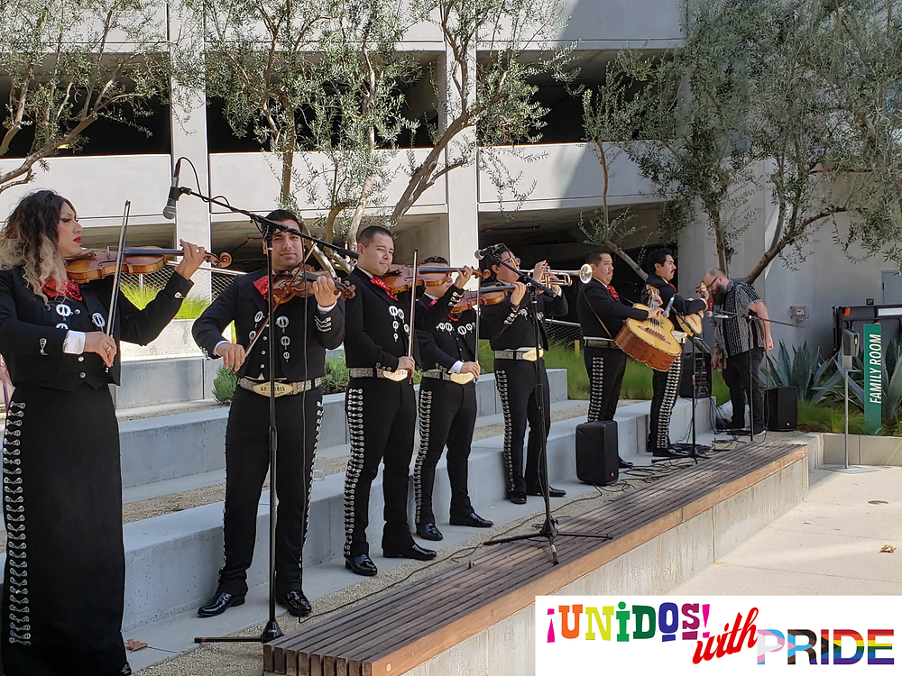 A mariachi band playing outside
