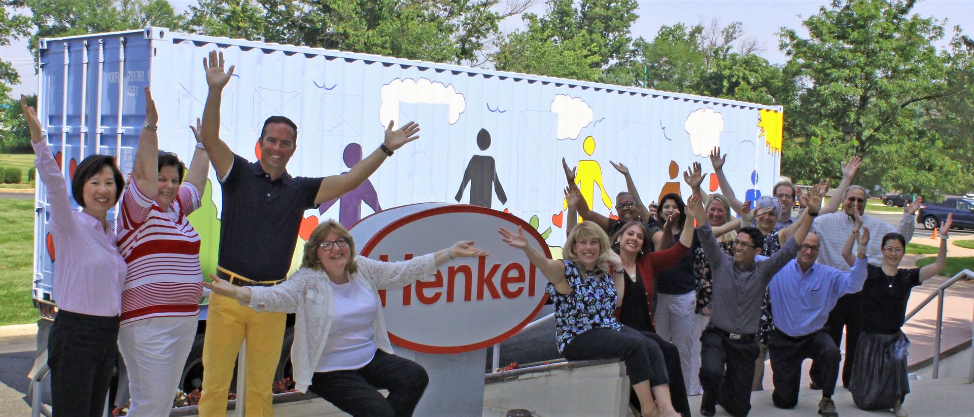 Employees excitedly bid the container-turned-classroom a hearty farewell.