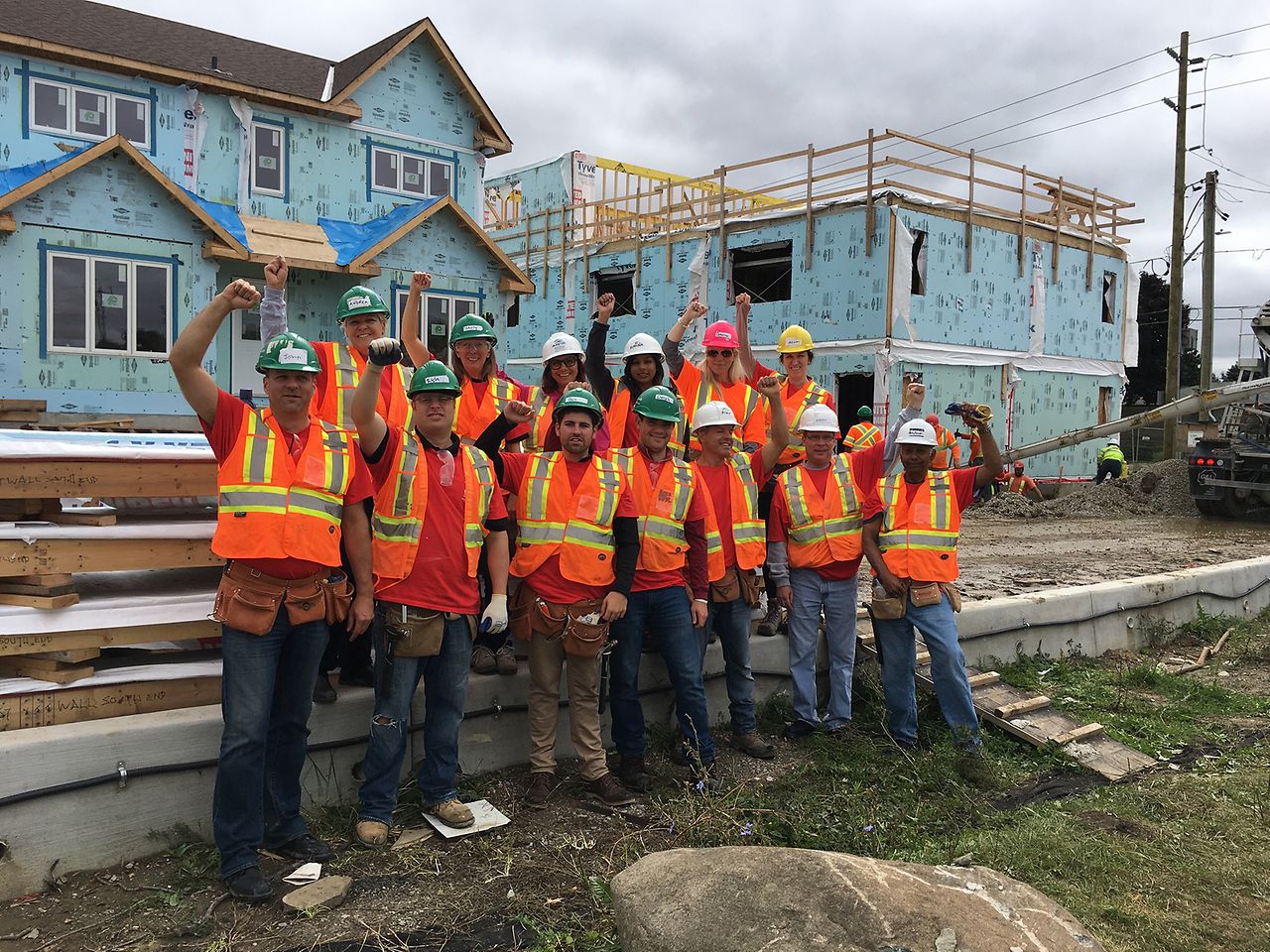 Henkel volunteers from our Mississauga, Canada office give a cheer at the start of their day building townhouses with Habitat for Humanity®.